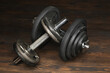 © Piotr Gdula - set of dumbbells  on wooden floor