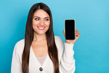 Sticker - Photo of pretty lady dressed white cardigan looking modern gadget empty space isolated blue color background