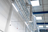 Fototapeta  - LED lighting - energy saving in the factory - large industrial hall