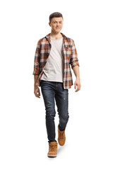 Wall Mural - Full length portrait of a guy in jeans and checkered shirt walking towards camera