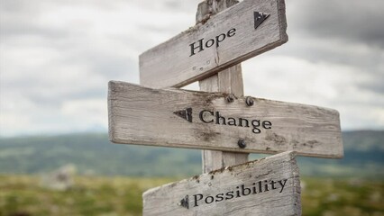 Wall Mural - hope change possibility text engraved on wooden signpost outdoors in nature.