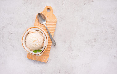 Fototapete - Coconut ice cream flavours in half of coconut setup on white stone background. Summer and Sweet menu concept.