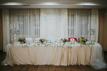 Wall Mural - A Closeup of a beautiful floral decoration of tables for a wedding event