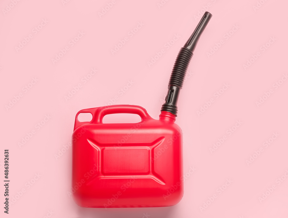 Plastic canister with rubber nozzle on color background