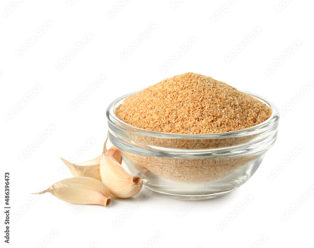 Bowl of dried garlic on white background