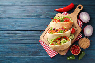 Wall Mural - Concept of tasty food with pitas with chicken, space for text