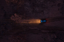 Aerial View Of A Car On Dirt Road In The Forest