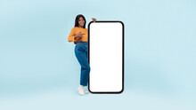 Black Lady Presenting Big White Empty Smartphone Screen