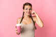 © luismolinero - Young woman with strawberry milkshake isolated on pink background having doubts and thinking