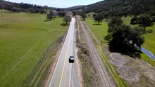 Drone Follows Car As It Merges Onto A Road And Drives