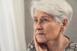 © PoppyPix - caucasian sad lonely pensive elderly woman with short grey hair and wrinkled face. High quality photo
