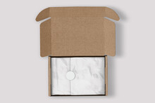Open Cardboard Mailing Box With White Tissue Paper Mockup On White Background