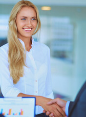 Canvas Print - Two successful business people shaking hands with each other