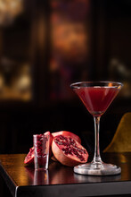 Pomegranate Martini In A Night Club Bar Garnished With Fruits