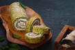 © happyimages - Spinach roulade filled with tomatoes, ham and ricotta for holiday dinner. Selective focus, copy space