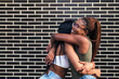 © Raul Mellado - couple of young women smiling happy and hugging
