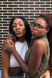 © Raul Mellado - two funny black friends throwing kisses at camera