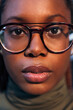 © Raul Mellado - portrait of serious young black woman with glasses