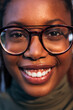 © Raul Mellado - portrait of young black woman with glasses smiling
