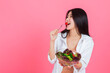 © Lucky-G - asian woman eating healthy fresh vegetable with copy space, Beauty healthcare diet and vegetarian lifestyle concept.