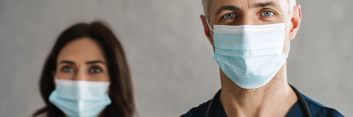 Sticker - Two confident doctors in medical masks standing