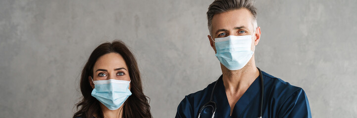 Sticker - Two confident doctors in medical masks standing