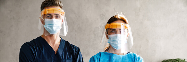 Sticker - Two doctors wearing protective medical uniform