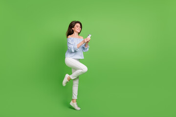 Sticker - Full size photo of adorable young lady chatting with best friend use telephone isolated on green color background