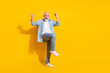Full length body size view of attractive funky cheerful grey-haired man rejoicing great news isolated over bright yellow color background