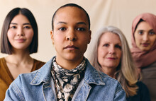 Mid Adult Mixed Race LGBTQ Woman In Support Of International Women's Day With Multi Ethnic Female Friends