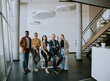 © BGStock72 - Group of positive businesspeople standing together in the office