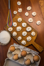 Delicious Crispy Homemade Egg Meringue, Prepared With Love On A Wooden Background, Crunchy Dessert For Coffee Or Tea.