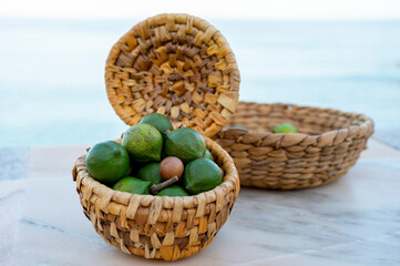 Wall Mural - New harvest of fresh ripe macadamia nuts in green shell