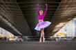© Raymond Forbes LLC/Stocksy - Urban Ballerina dancing in the city under bridge