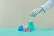 © Yaroslav Danylchenko/Stocksy - Scientist pouring liquid into test tube