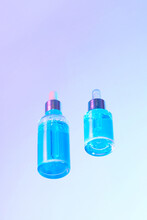 Serum In Bottles On Glass Table