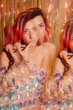 © Liliya Rodnikova/Stocksy - Woman eating cookie during party