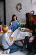 © Oleksii Syrotkin/Stocksy - Girl demonstrate present to relatives during Christmas