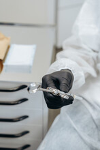 Hand Of Dentist Holds Dental High Speed Turbine