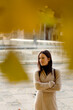 © Mauro Grigollo/Stocksy - Woman in town in the fall season
