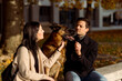 © Mauro Grigollo/Stocksy - Couple looks at their dog