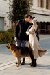 © Mauro Grigollo/Stocksy - Couple kiss outdoor