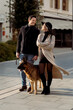 © Mauro Grigollo/Stocksy - Happy couple with a dog