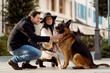 © Mauro Grigollo/Stocksy - People stroking the dog