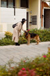 © Mauro Grigollo/Stocksy - Woman with her dog in the city