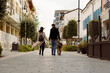 © Mauro Grigollo/Stocksy - People during a walk with the dog