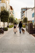 © Mauro Grigollo/Stocksy - A couple walks in town
