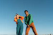 © Alba Vitta/Stocksy - Cool friends listening to music and dancing
