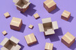 © Marc Tran/Stocksy - Lot of cardboard boxes on purple background
