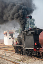 Steam Locomotive Emitting Heavy Smoke Before A Start.